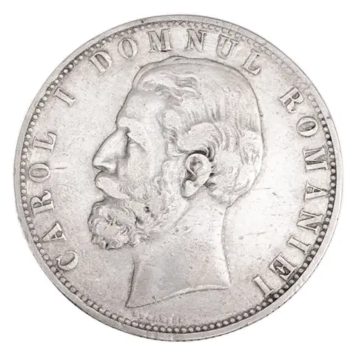 Румыния 5 леев 1880 года, Имя дизайнера рядом с гуртом